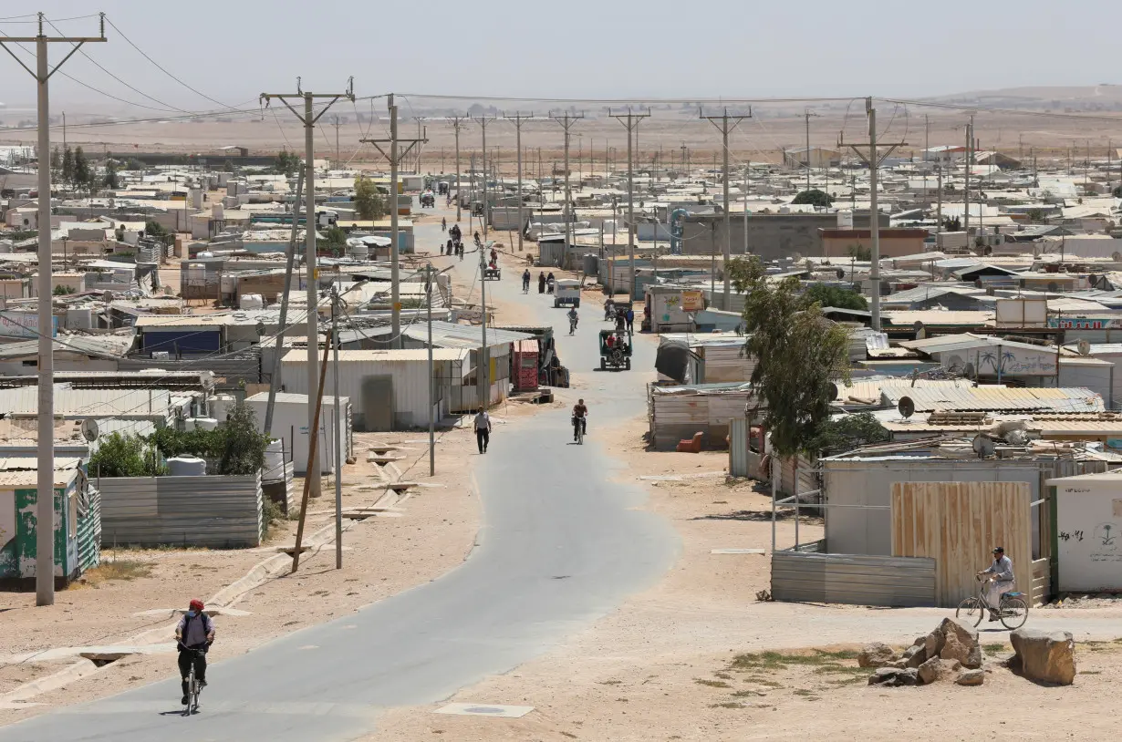 Syrian refugees are seen at the Zaatari refugee camp in the Jordanian city of Mafraq