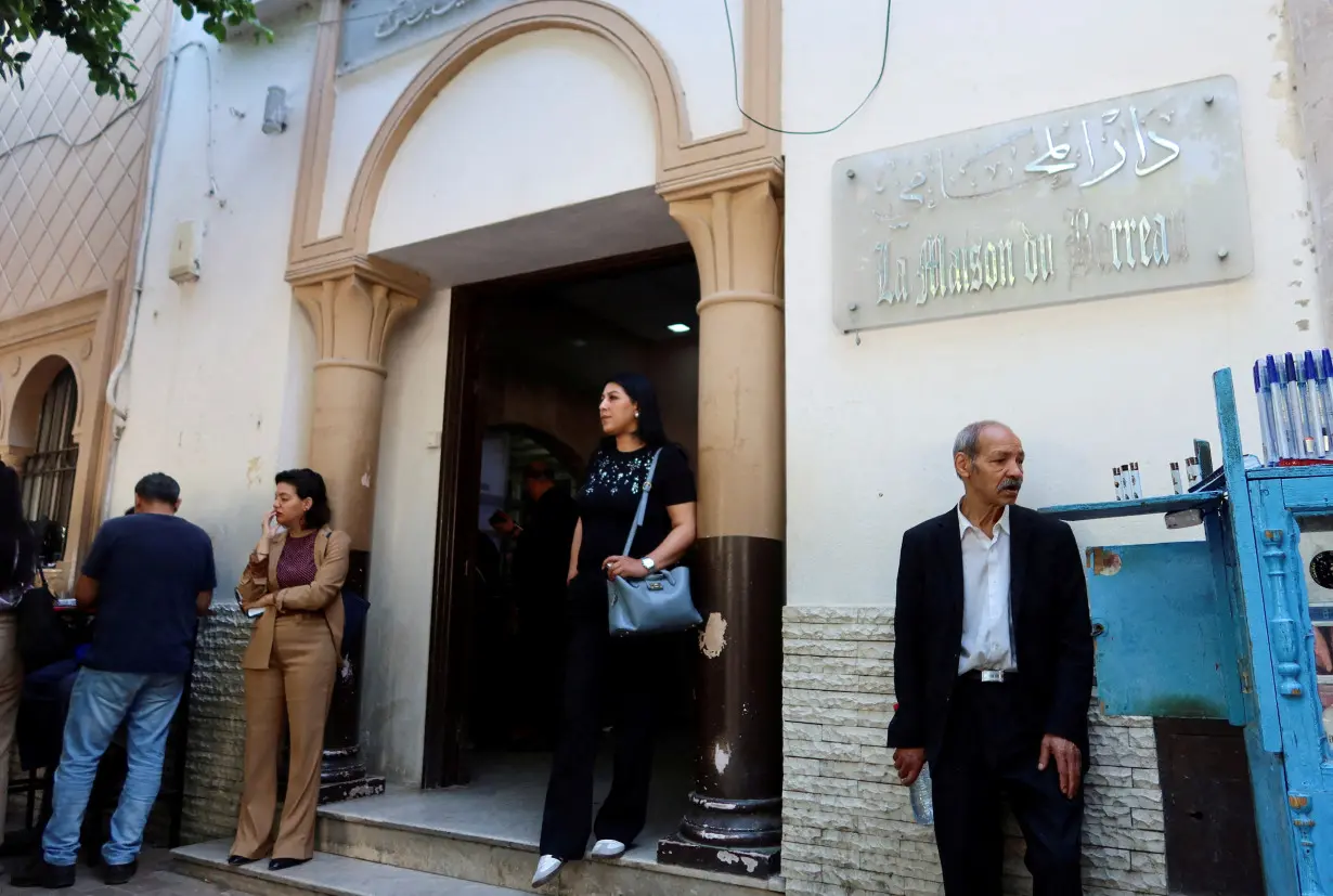 FILE PHOTO: A woman walks out of the building of the Deanship of Lawyers in Tunis