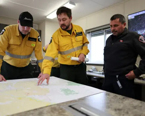 Rain is set to help crews battling blaze near Canadian oil city