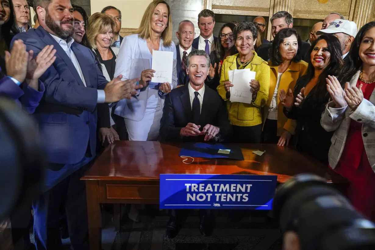 California governor signs 2 major proposals for mental health reform to go before voters in 2024