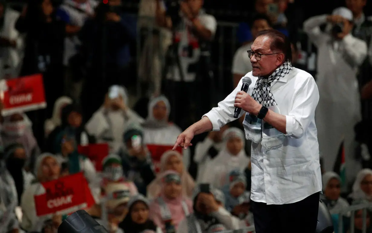 FILE PHOTO: Malaysia Prime Minister Anwar Ibrahim delivers his speech during a solidarity gathering to show support for Palestinians in Kuala Lumpur