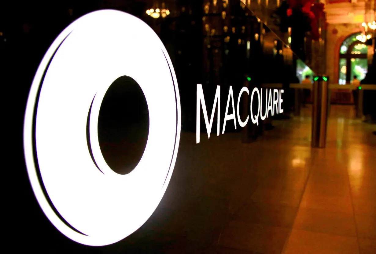 FILE PHOTO: The logo of Australia's Macquarie Group adorns a desk in the reception area of its Sydney headquarters