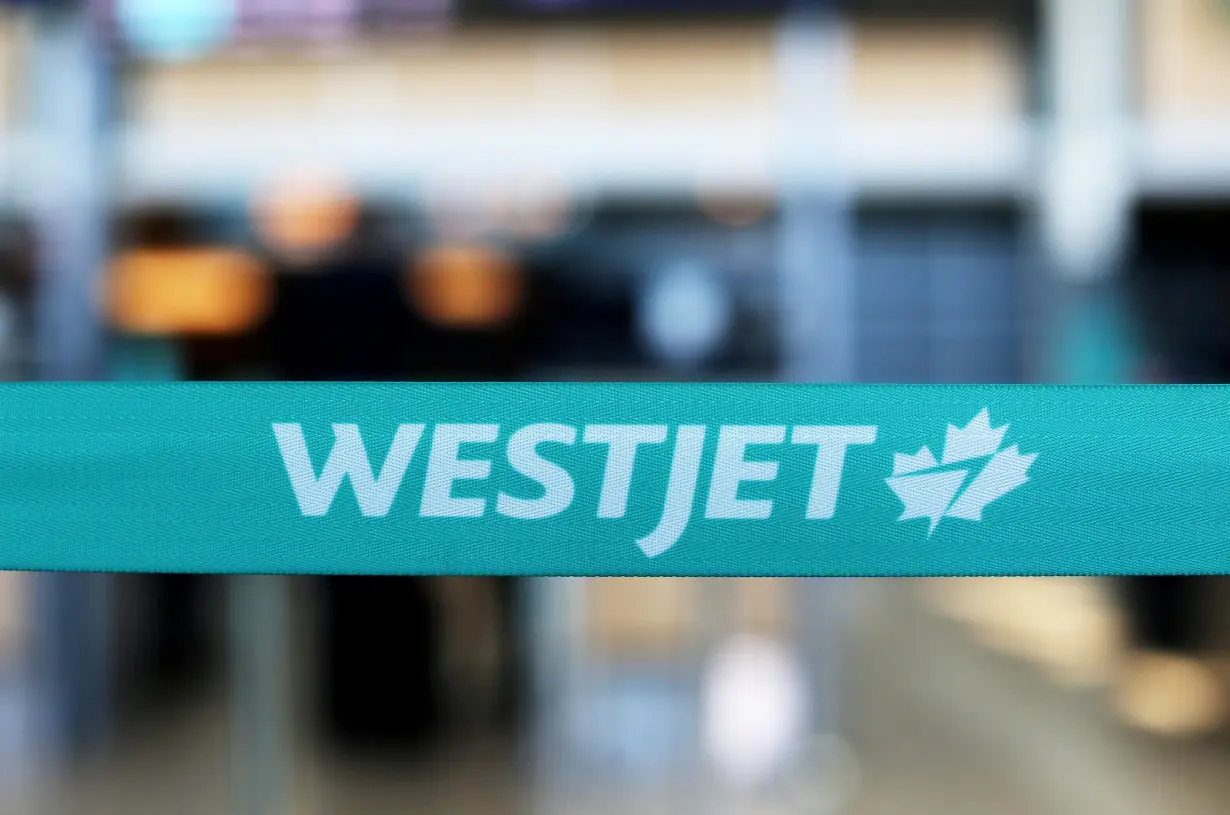 FILE PHOTO: WestJet airline signage is pictured at Vancouver's international airport in Richmond,