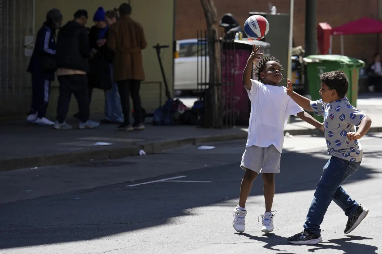 With a vest and a voice, helpers escort kids through San Francisco’s broken Tenderloin streets