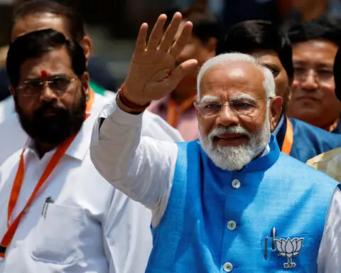 India's Modi denies stoking divisions to win election, files nomination