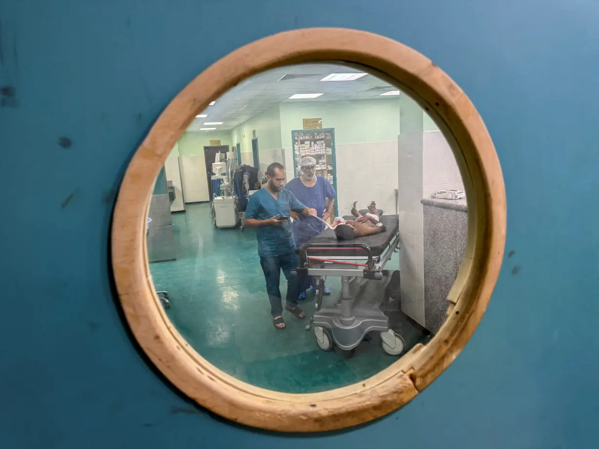 Palestinian boy Ahmed Abu Athab, who was wounded in an Israeli strike, receives treatment at Nasser hospital in Khan Younis, in the southern Gaza Strip