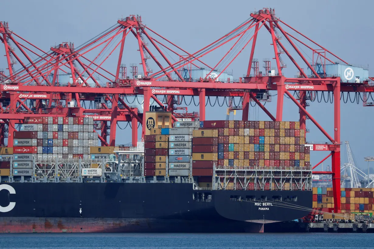 A container ship is shown at port in Long Beach, California