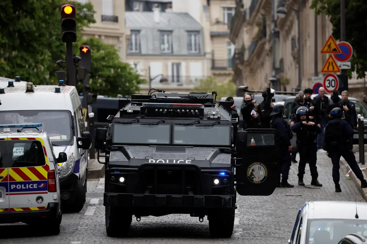 French police cordoned off Iranian consulate in Paris where a man is threatening to blow himself up