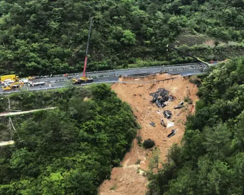 Death toll jumps to at least 48 as a search continues in southern China highway collapse