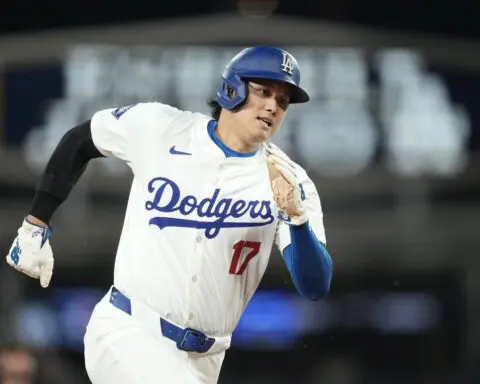 Ohtani hits 2-run homer and scores go-ahead run on his special day in LA as Dodgers beat Reds 7-3