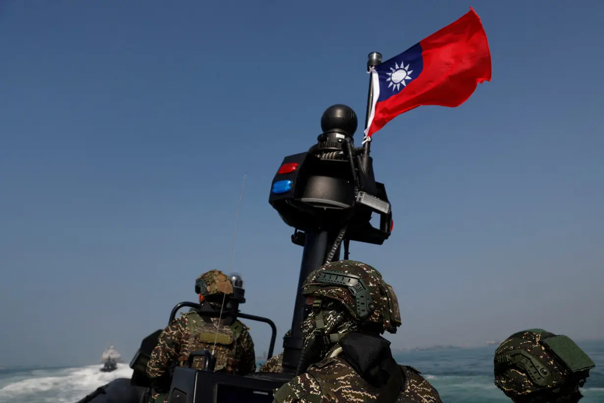 FILE PHOTO: Members of Taiwan's Navy in a drill part of a demonstration for the media at a navy base in Kaohsiung