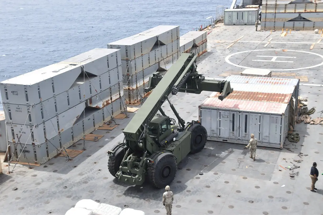 FILE PHOTO: U.S. Navy personnel construct a JLOTS to assist aid to Gaza in the Mediterranean Sea