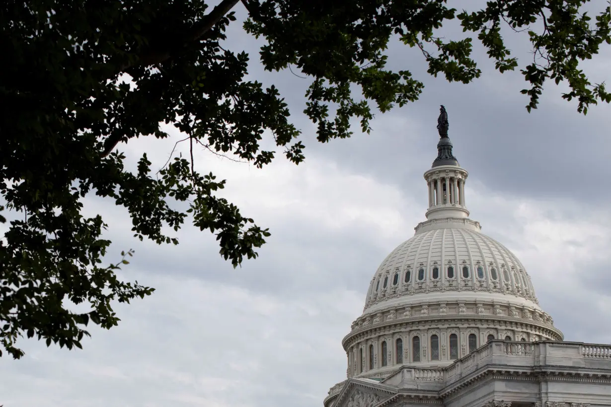 FILE PHOTO: Clouds pass over the U.S. Capitol dome in Washington