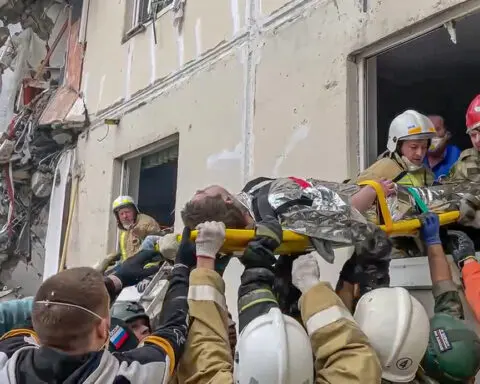 Apartment building partially collapses in a Russian border city after shelling. At least 13 killed