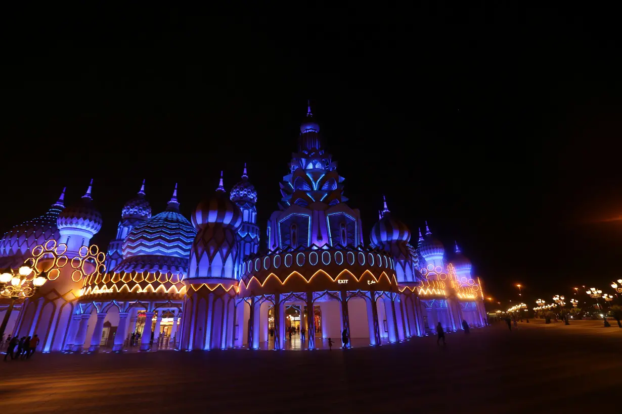 People are seen at Global Village in Dubai