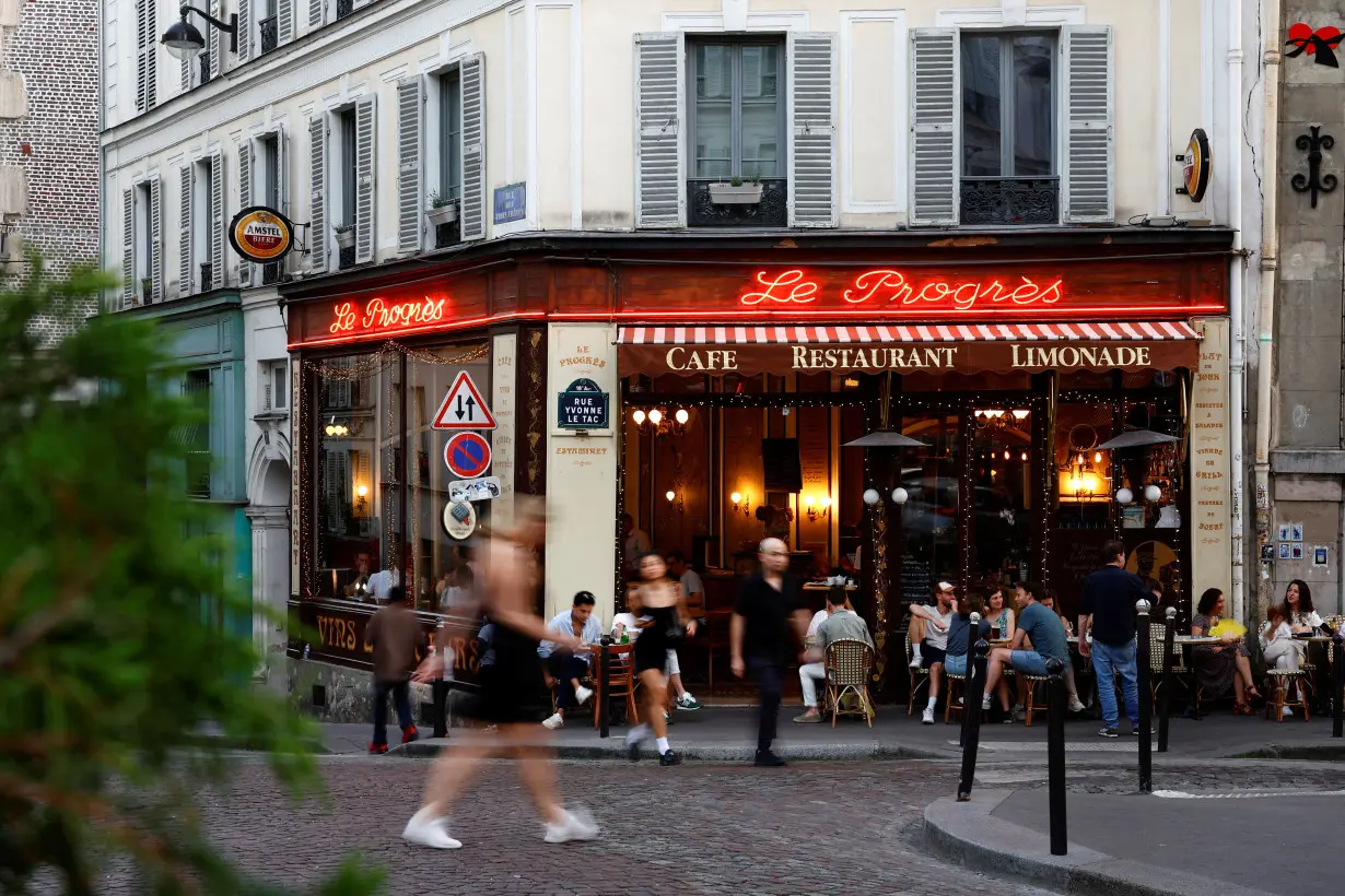 People enjoy a sunny day in Paris