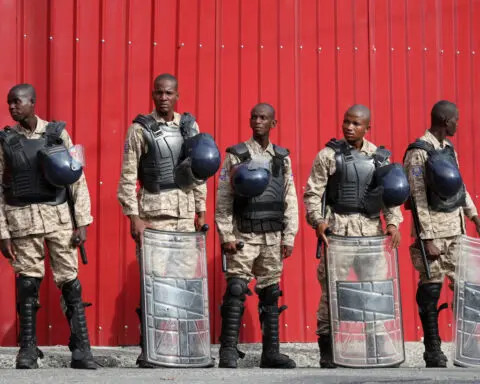 Haiti transitional government takes power as gangs hold capital 'hostage'