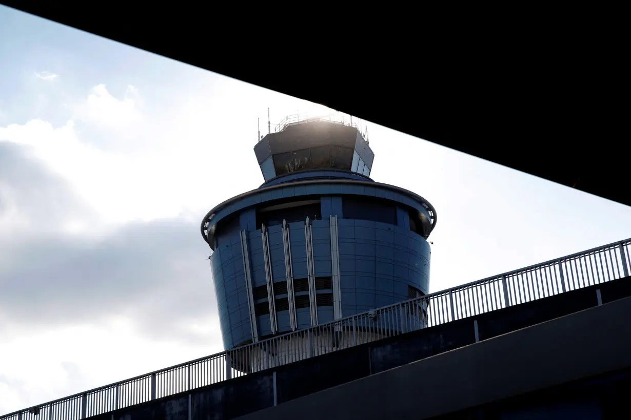 FILE PHOTO: The control tower at LaGuardia Airport in New York City is seen after after hundreds of flights were delayed or grounded in New York