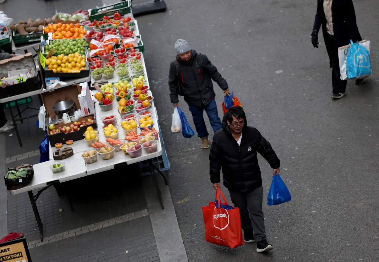 People walk through Surrey Street market in Croydon