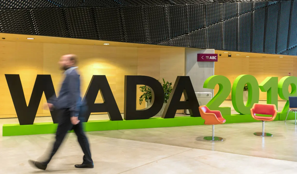 A man walks at the World Anti-Doping Agency (WADA) venue on the eve of the Fifth World Conference on Doping in Sport in Katowice