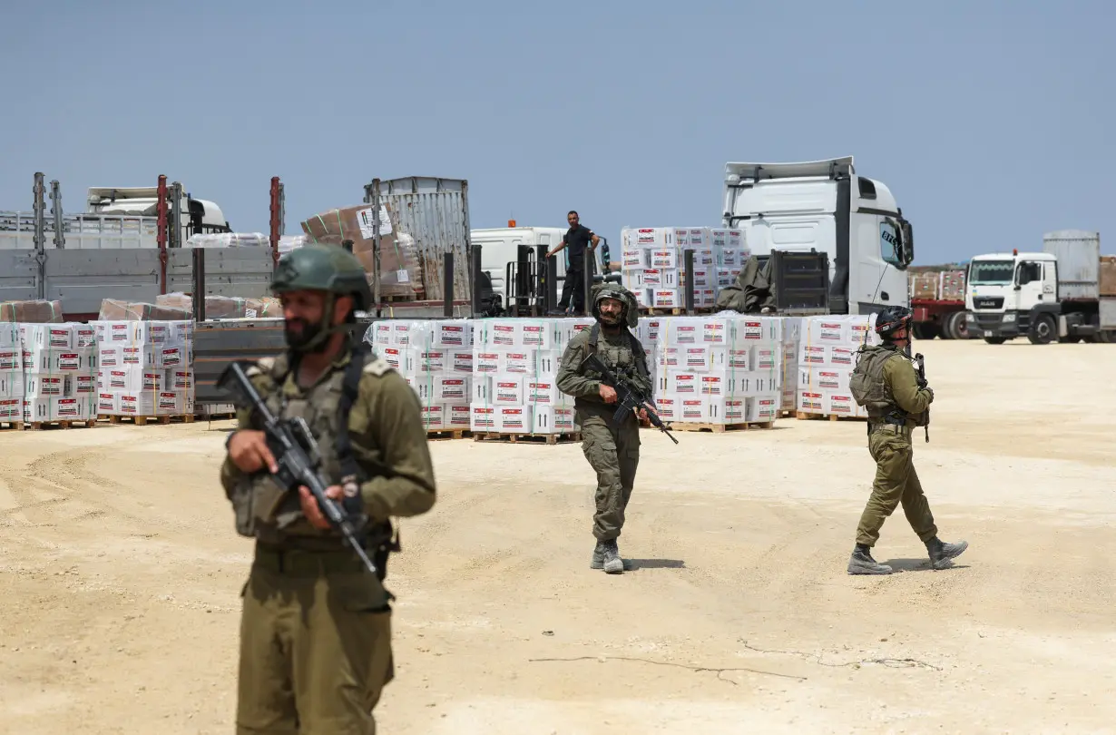 Israeli soldiers secure humanitarian aid near Erez Crossing in northern Gaza