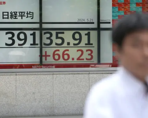 Stock market today: Asian shares mostly decline after Nasdaq ticks to a record high