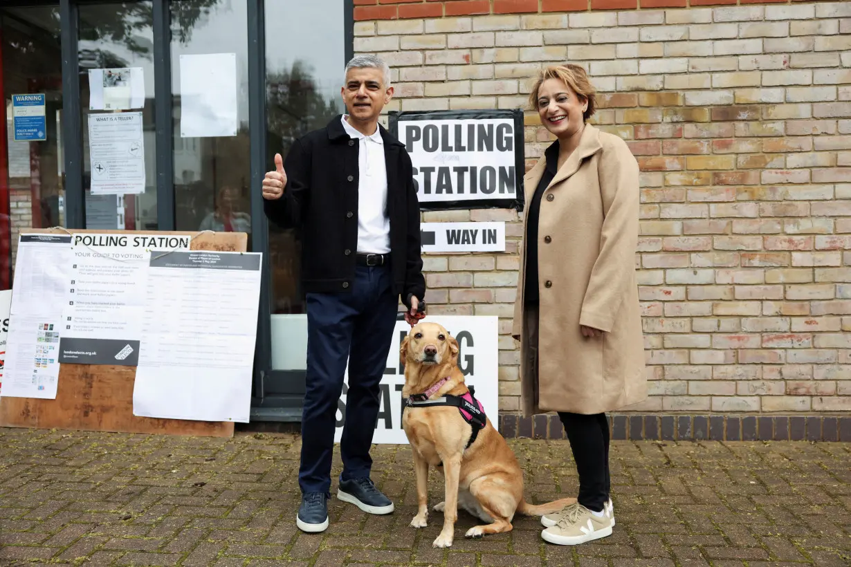 FILE PHOTO: Mayor of London Sadiq Khan walks at a polling station during local elections in London