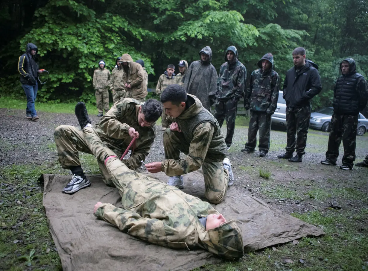 Pupils fire weapons and practise first aid at a range in Vladikavkaz