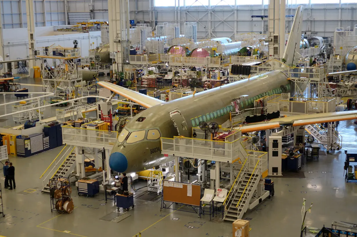 FILE PHOTO: An Airbus A220 passenger jet stands in the final assembly line, where the European company plans a $30 million investment to keep up with forecast demand