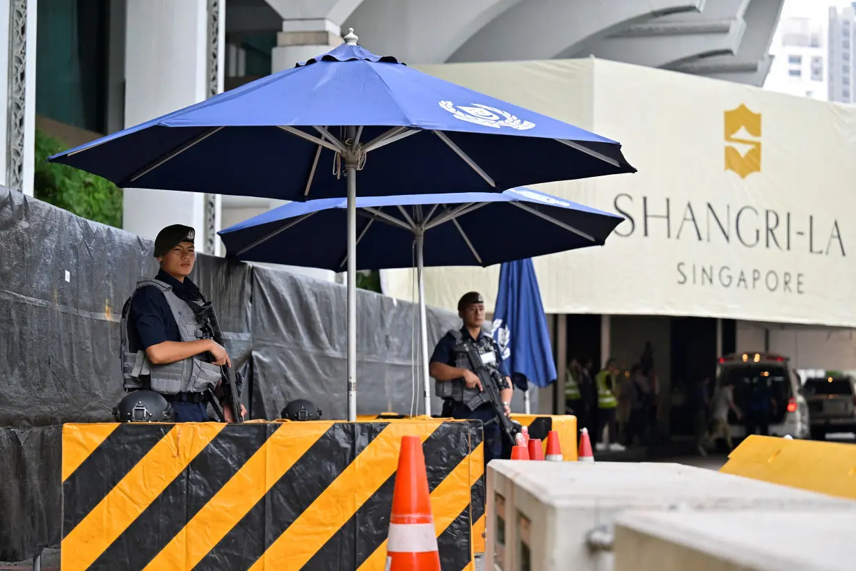 FILE PHOTO: Gurkhas stand guard at the entrance of the venue of the 20th Shangri-La Dialogue in Singapore