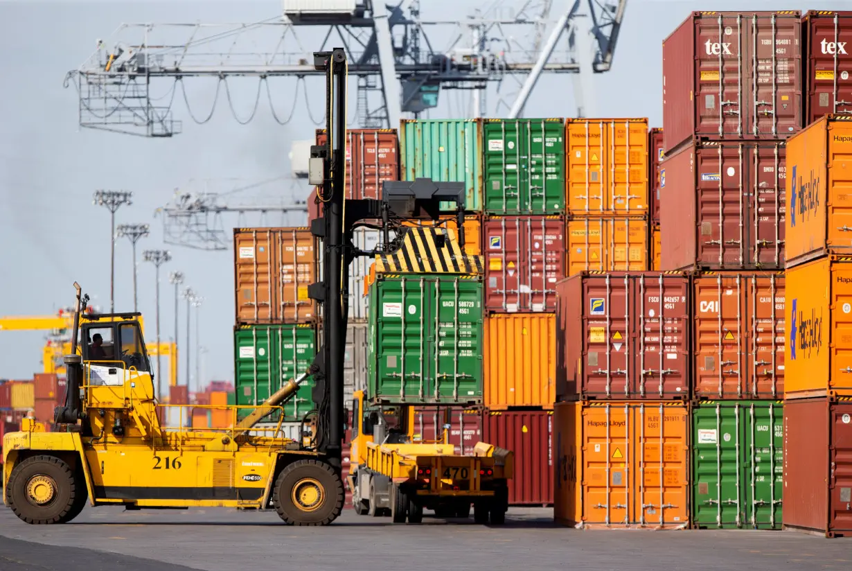 A shipping container is unloaded at the Port of Montreal