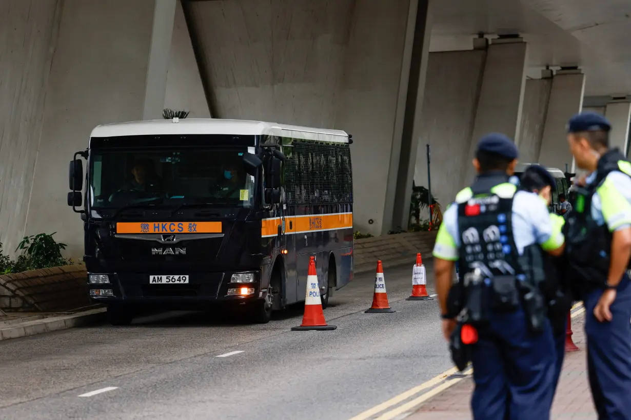 A prison van arrives at the West Kowloon Magistrates' Courts building before the verdict of 47 pro-democracy activists charged under the National Security law in Hong Kong