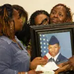 Questions and grief linger at the apartment door where a deputy killed a US airman