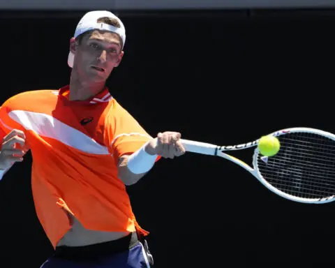A French player at the French Open gets only a warning when his ball strikes a fan