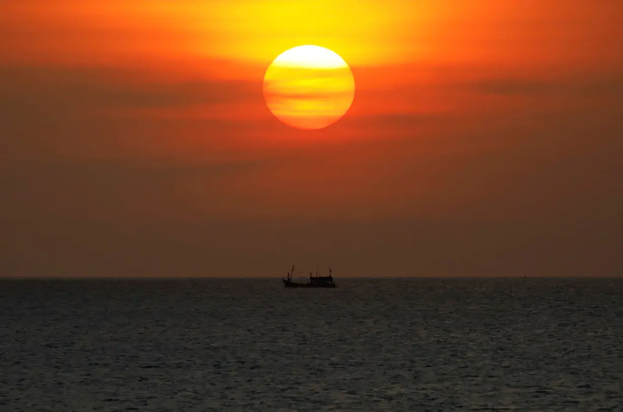 FILE PHOTO: A boat sails on the Gulf Of Thailand during the sunset at Ko Samui in Thailand