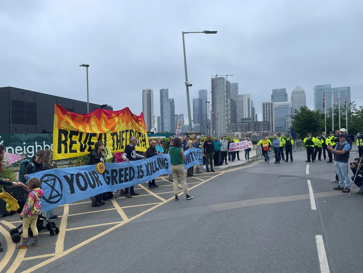 Climate protesters demonstrate outside Shell's annual general meeting in Greenwich, London