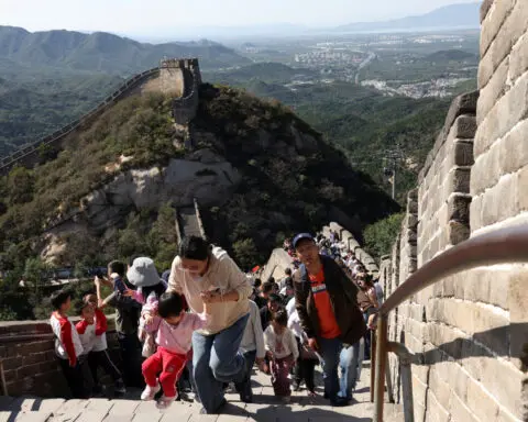 China travel surges for May holiday but consumers remain wary