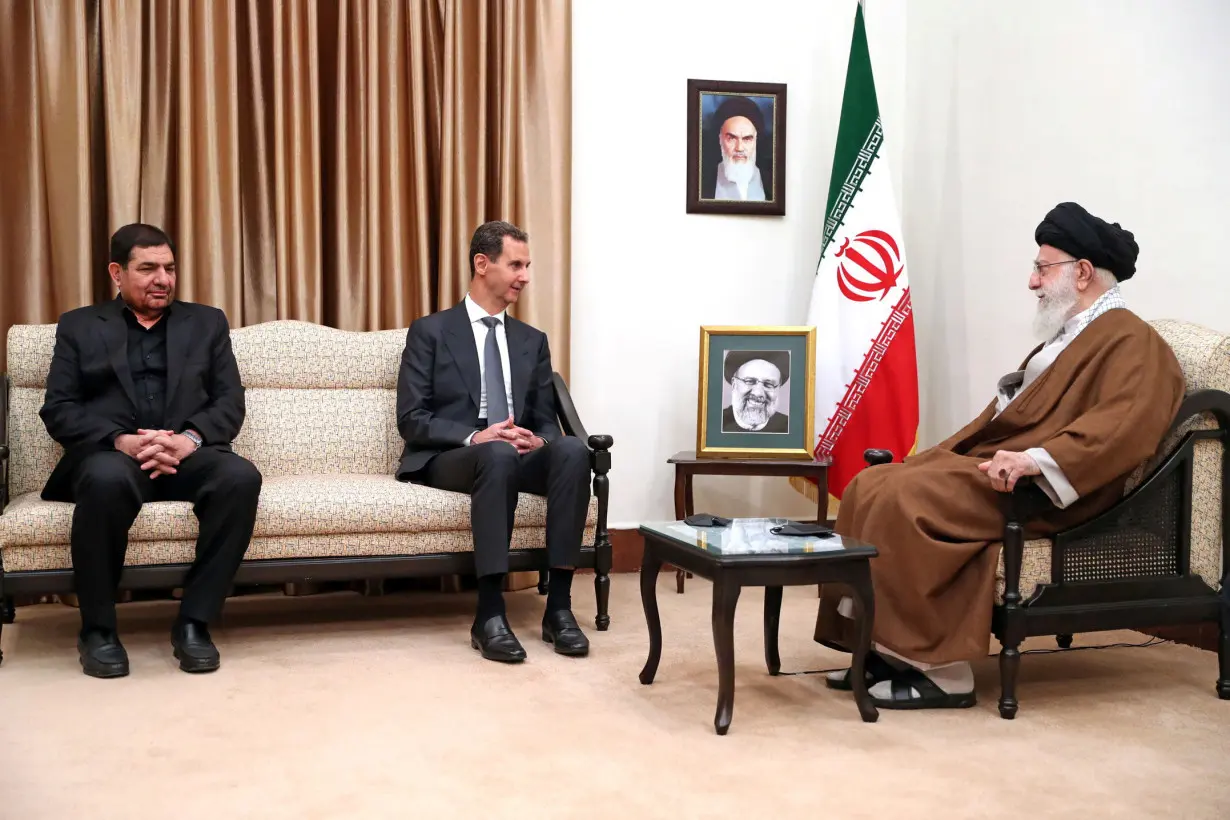 Iran's Supreme Leader Ayatollah Ali Khamenei meets with Syrian President Bashar al-Assad, in Tehran