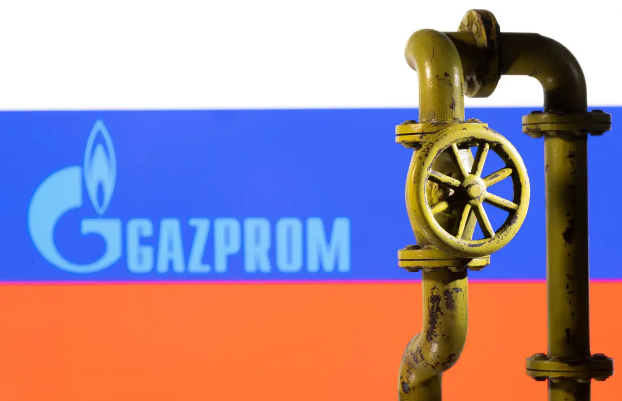 Illustration shows Gazprom logo and Russian flag