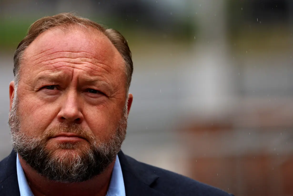 Infowars founder Alex Jones speaks after appearing at his Sandy Hook defamation trial in Waterbury