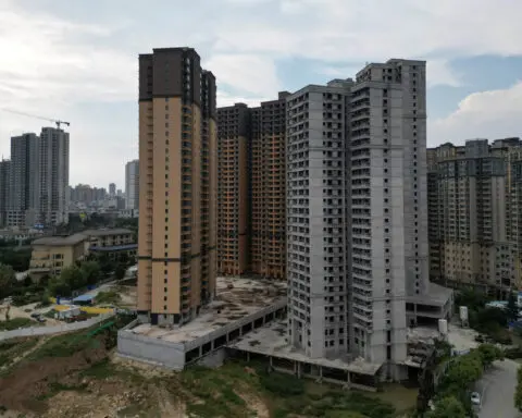 China to cut mortgage interest rates, home down-payment ratio to boost demand