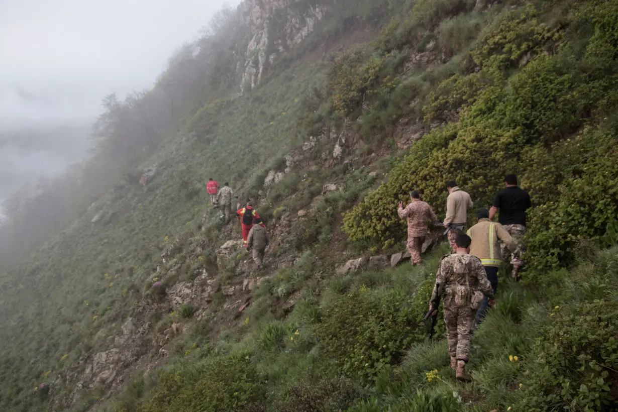 FILE PHOTO: FILE PHOTO: Rescue team works following a crash of a helicopter carrying Iran's President Ebrahim Raisi, in Varzaqan