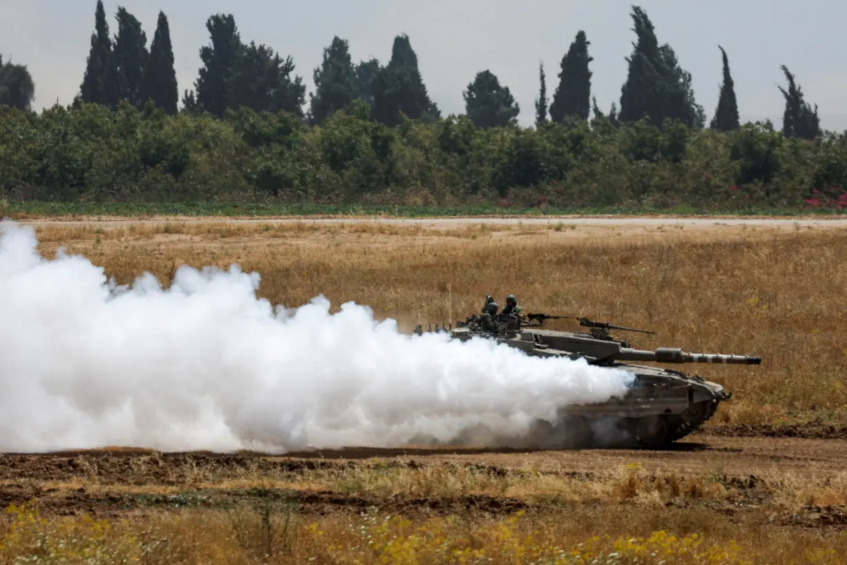 An Israeli tank manoeuvres near the Israel-Gaza border