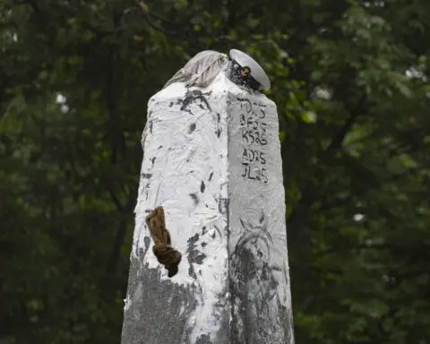 A greasy, monumental ritual at the Naval Academy ends after more than 2 hours