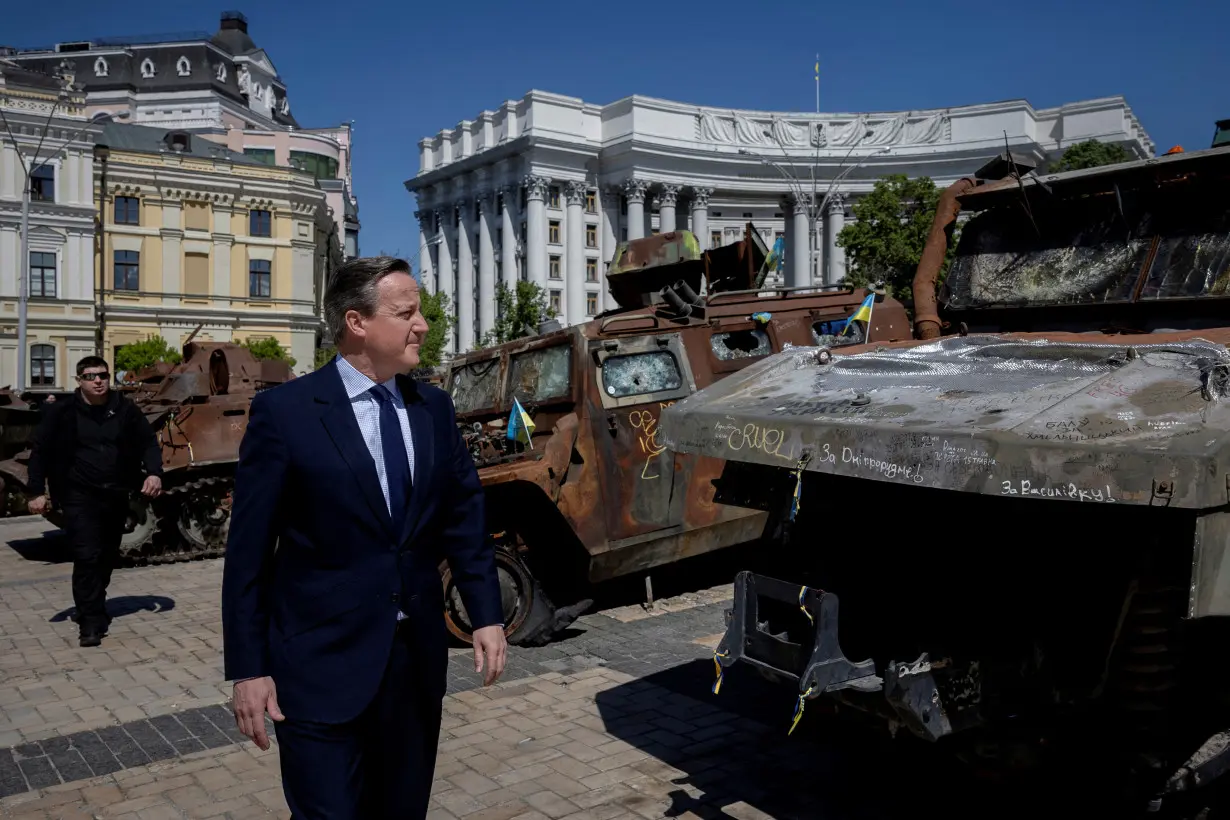 FILE PHOTO: Britain's Foreign Secretary David Cameron and Ukrainian Foreign Minister Dmytro Kuleba meet in Kyiv