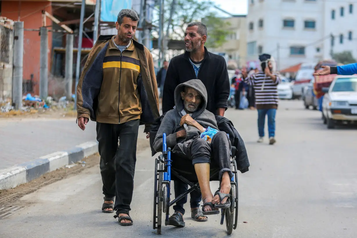 People flee the eastern parts of Rafah after the Israeli military began evacuating Palestinian civilians ahead of a threatened assault on the southern Gazan city