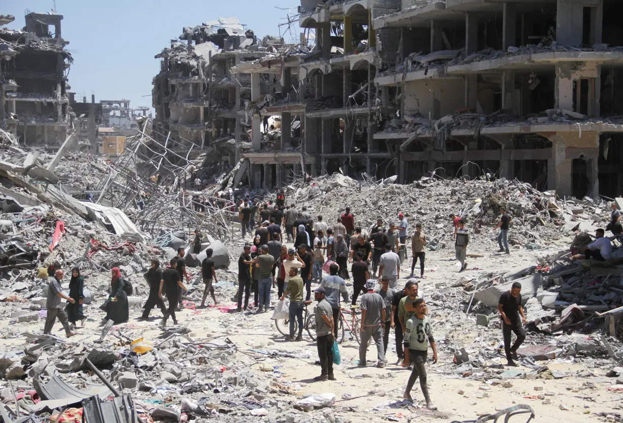 Palestinians inspect the damage after Israeli forces withdrew from Jabalia refugee camp