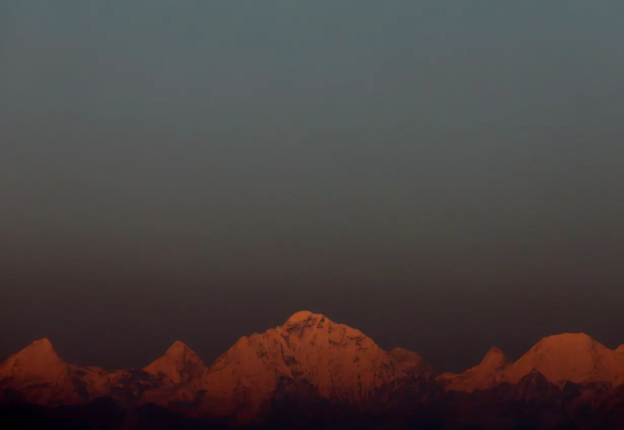 FILE PHOTO: Mount Everest, the world's highest mountain, and other peaks of the Himalayan range are seen during sunset from Kathmandu