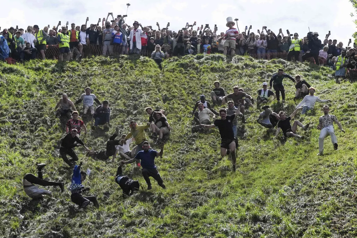 Chasing cheese wheels or lugging sacks of wool, UK competitors embrace quirky extreme races