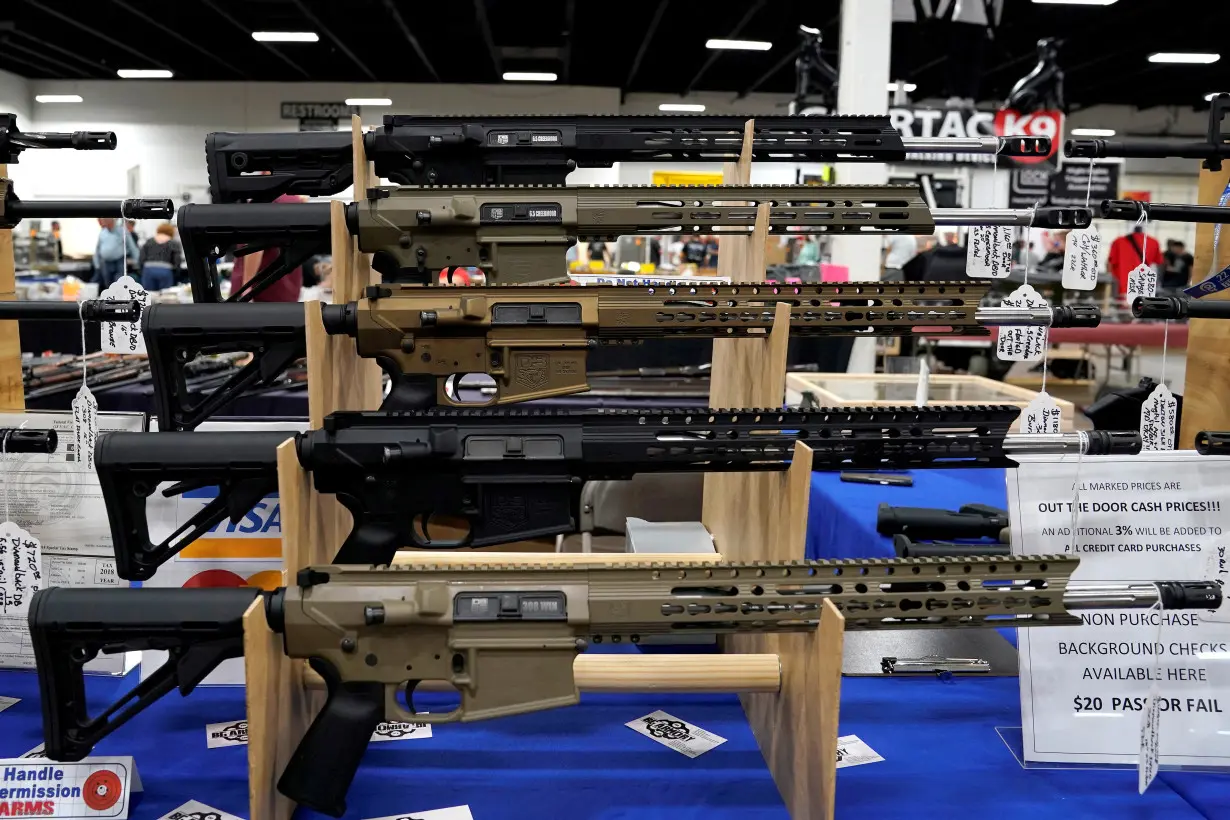 FILE PHOTO: AR-15 rifles are displayed for sale at the Guntoberfest gun show in Oaks, Pennsylvania